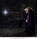 stock-photo-wizard-in-a-purple-robe-and-wizard-hat-casting-a-spell-with-his-wand-15224773