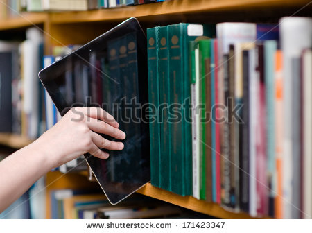 stock-photo-closeup-hand-putting-a-tablet-pc-in-the-shelves-in-the-library-171423347