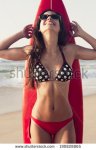 stock-photo-a-beuatiful-and-sexy-surfer-girl-at-the-beach-with-her-surfboard-190828865