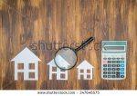 stock-photo-buy-house-mortgage-calculations-calculator-with-magnifier-searching-347646575